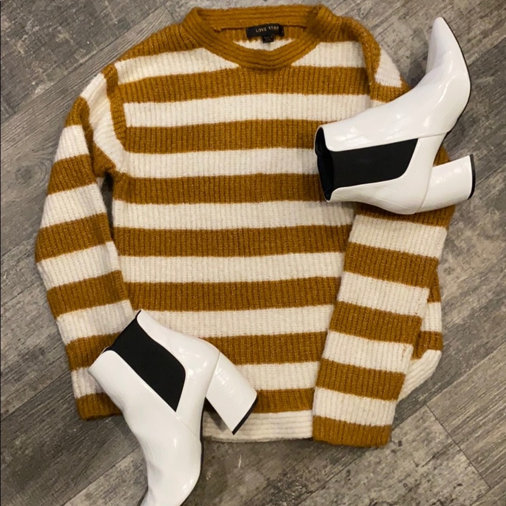 Mustard and cream color sweater.